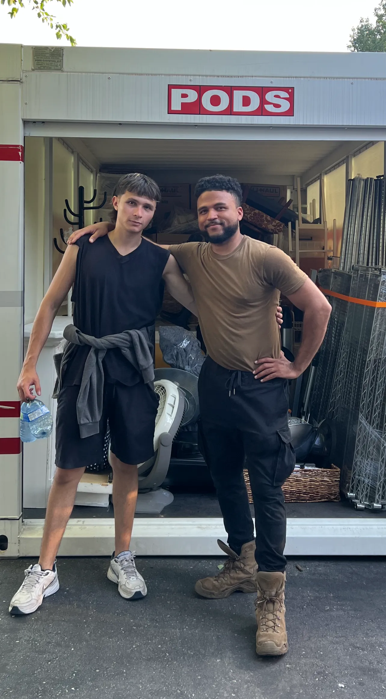 David and Julian from Olympus Movers posing together for a picture after a hard days work